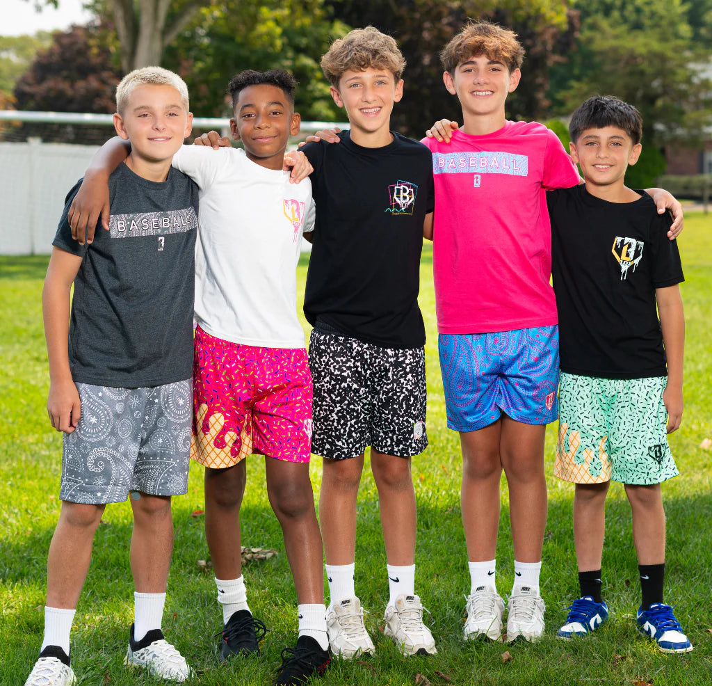 5 boys posing outside at summer camp
