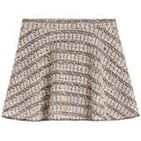 A structured A-line skirt in a black and beige tweed bouclé fabric with subtle multicolor flecks, shown flat against a white background.