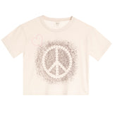 A cream-colored short-sleeve crop top t-shirt featuring a distressed peace sign graphic in the center with a small pink heart outline on the upper left chest.