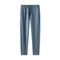 A pair of men's lounge pants in a dusty slate blue color, featuring an elastic waistband with a matching drawstring and side pockets, shown against a plain white background.
