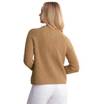 A woman shown from the back wearing a ribbed knit cropped sweater in camel tan and white pants, against a plain white studio background.