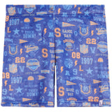 A pair of blue athletic shorts featuring a vibrant collegiate sports print with orange and light blue text, numbers, and logos including 'Game Day', 'Champions', and NFL shield emblems.