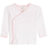 A white long-sleeve baby wrap top with light pink scalloped trim along the V-neckline and button closure, shown flat on a white background.