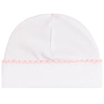 A white knit baby beanie hat featuring a delicate light pink braided trim along the folded cuff.