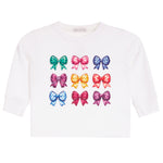A white long-sleeve t-shirt for toddlers, featuring a graphic print of nine colorful bows arranged in a 3x3 grid on the front.