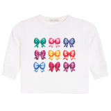A white long-sleeve t-shirt for toddlers, featuring a graphic print of nine colorful bows arranged in a 3x3 grid on the front.