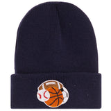 A navy blue knit beanie with a folded cuff featuring an embroidered patch of sports balls including a football, basketball, baseball, and soccer.