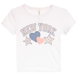 A white short-sleeve kids' t-shirt featuring a 'NEW YORK' graphic on the front with three hearts and stars in light blue, pink, and white.