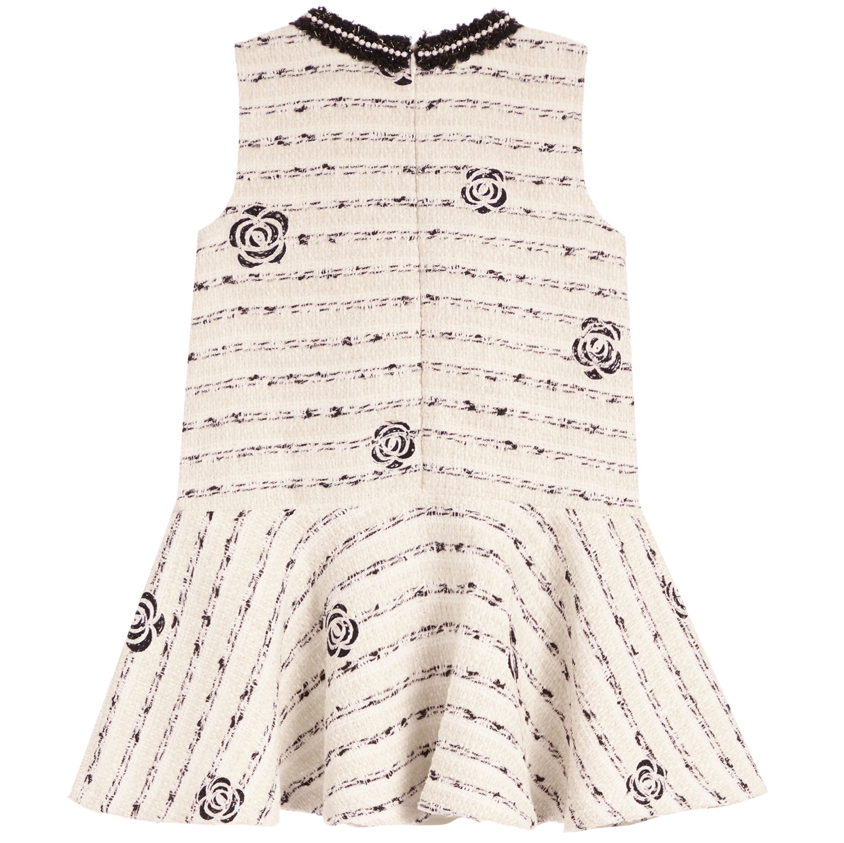 A sleeveless cream-colored dress with a black musical staff pattern and embroidered rose motifs, featuring a ruffled peplum hem and a black lace-trimmed neckline.