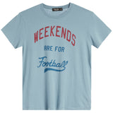 A light blue short-sleeve crewneck t-shirt with a distressed graphic print reading 'WEEKENDS ARE FOR Football' in red and blue lettering.
