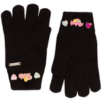 A pair of black knit gloves with colorful decorative patches and charms on the cuffs, shown against a plain white background.