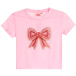 A light pink short-sleeve crop top featuring a large, decorative pearl-embellished bow on the front, displayed against a solid white background.