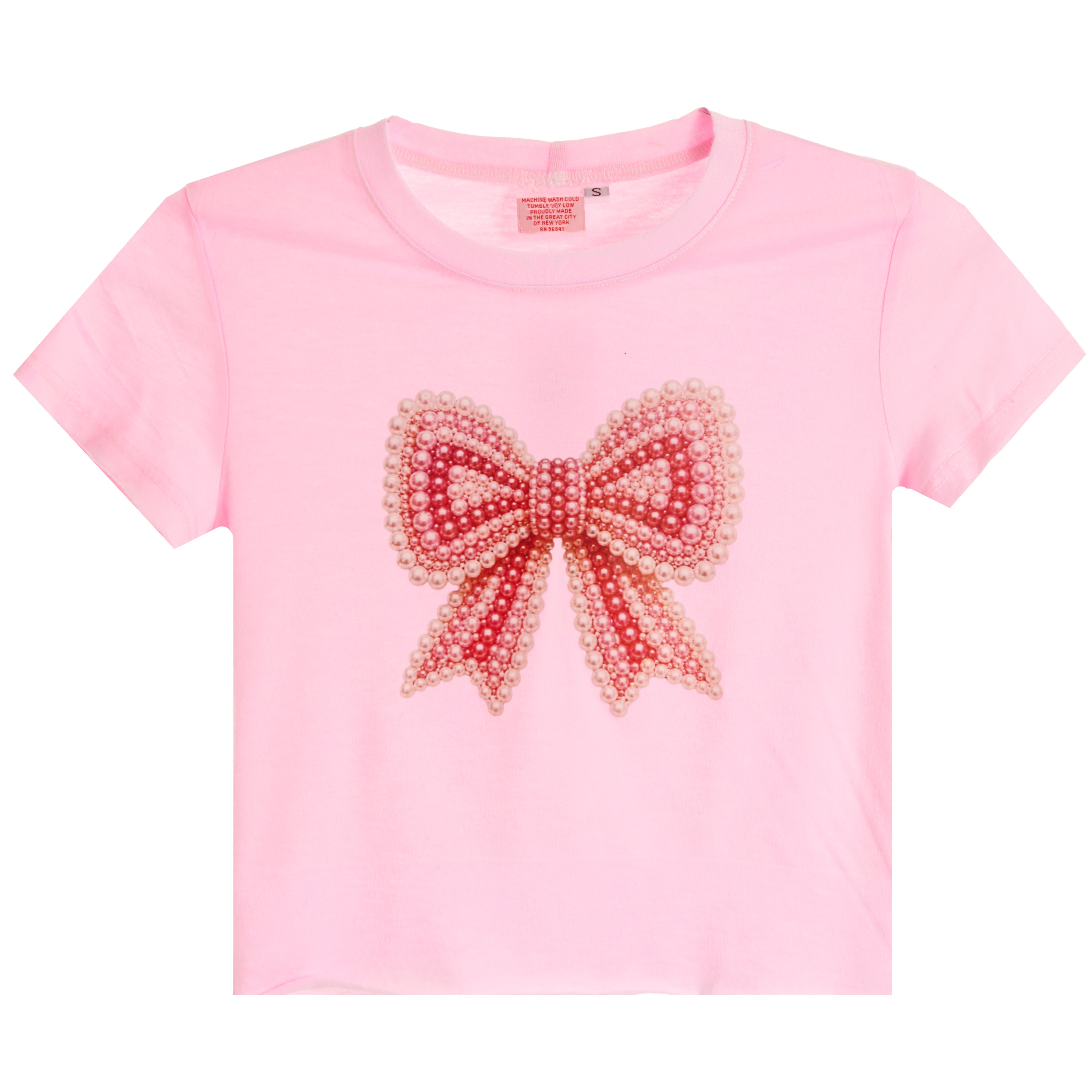 A light pink short-sleeve crop top featuring a large, decorative pearl-embellished bow on the front, displayed against a solid white background.