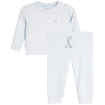 A baby or toddler two-piece loungewear set in light blue, featuring a long-sleeve sweatshirt with a small embroidered smiley face on the chest and matching jogger pants with a drawstring waist.