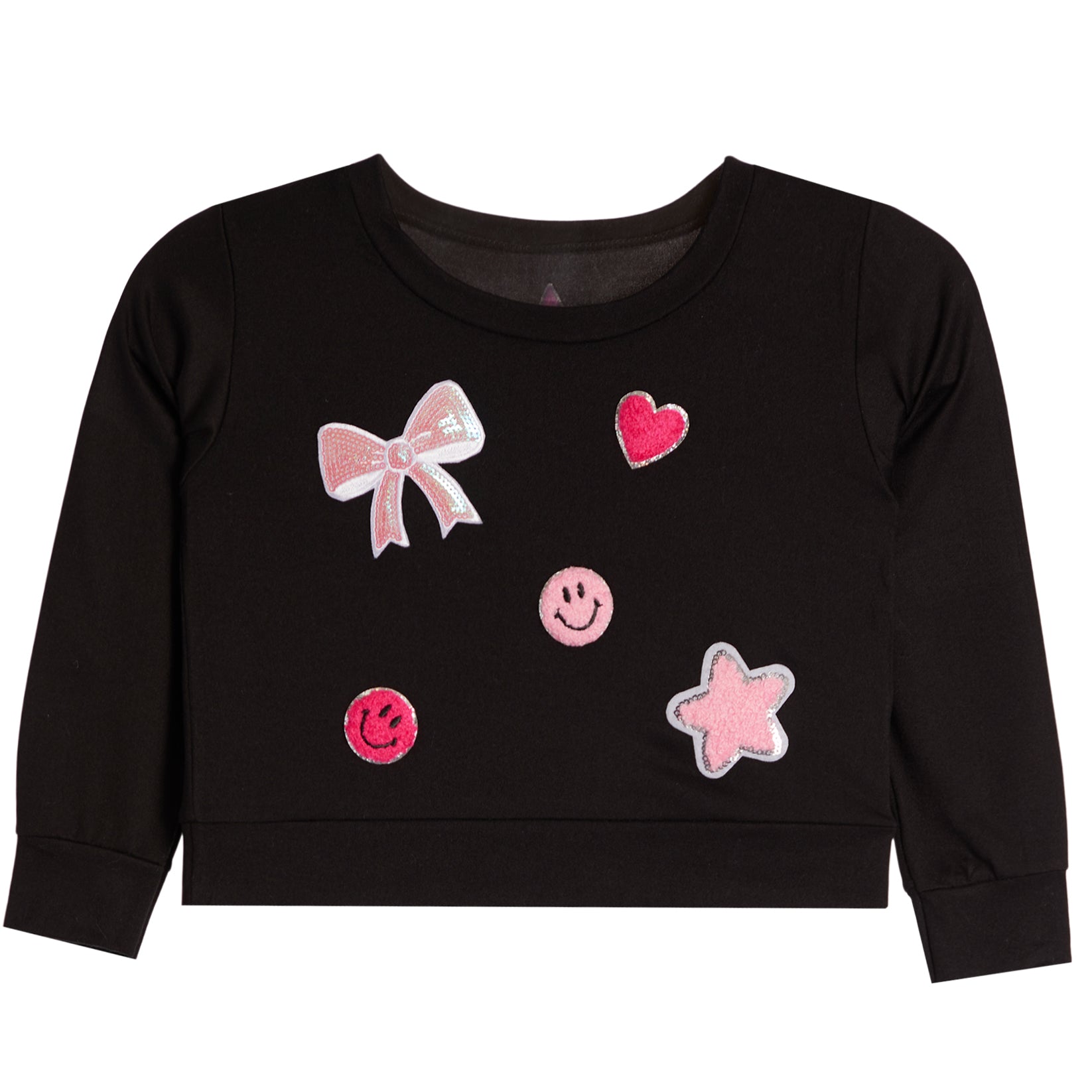 A black long-sleeve sweatshirt for toddlers, featuring pink and white applique patches including a bow, hearts, smiley faces, and a star on the front.