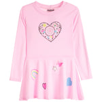 A pink long-sleeve dress for kids with a ruffled hem, featuring a large heart graphic on the chest and smaller rainbow, butterfly, and heart graphics on the front.