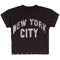 A charcoal short-sleeve crop top T-shirt featuring a distressed white arched 'NEW YORK CITY' graphic on the front, with metal eyelet details along the sleeve cuffs and hem.