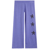 Purple wide-leg sweatpants featuring three drippy star motifs outlined in black on the right leg, displayed against a solid white background.