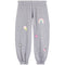 A pair of kids' heather gray sweatpants featuring colorful embroidered patches including a rainbow, ice cream cone, pink heart, star, and cherries.