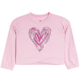 A pink long-sleeve cropped sweatshirt featuring a large, layered glittery heart graphic on the front in shades of pink and silver.