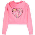 A pink cropped hoodie sweatshirt with a long hood and a large, featuring a decorative heart-shaped applique on the back with bandana print and a yellow sun and rainbow, shown against a plain white background.