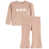 A two-piece baby knit set featuring a long-sleeve top with three cream hearts on the chest and matching flared pants, both in a dusty rose pink ribbed knit.