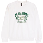A white crewneck sweatshirt featuring a green graphic print on the front that reads 'MAHJONG Social Club' with two playing cards and a laurel wreath.