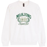 A white crewneck sweatshirt featuring a green graphic print on the front that reads 'MAHJONG Social Club' with two playing cards and a laurel wreath.