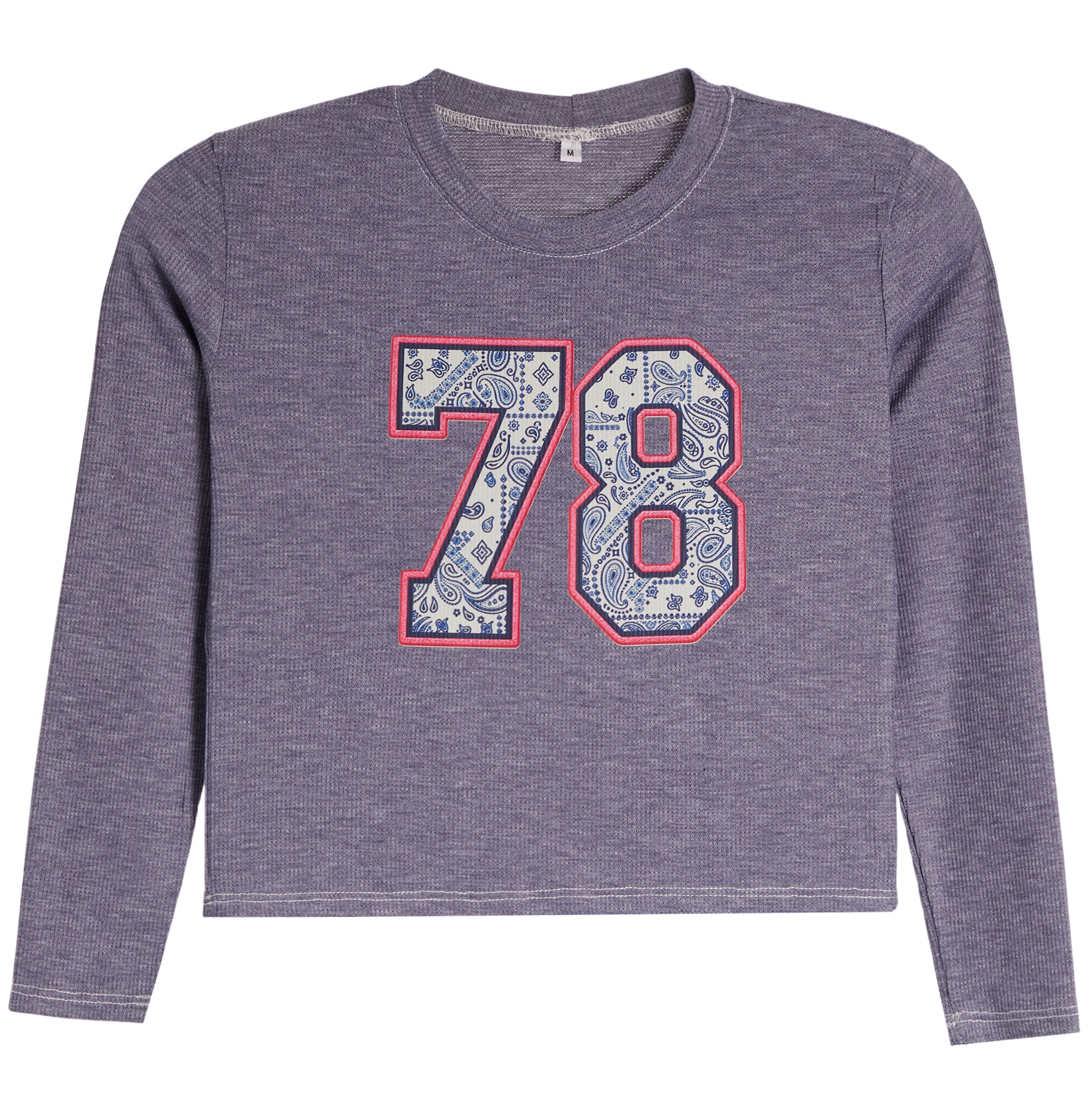 A kids' long-sleeve crop top in heathered periwinkle purple, featuring a large '78' graphic on the chest with a blue paisley pattern and a red outline.