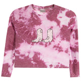 A pink and white tie-dye long-sleeve crop top with a graphic of two cowboy boots on the chest, displayed flat against a white background.