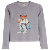 A gray long-sleeve crewneck shirt featuring a graphic of a teddy bear wearing a blue cap, white shirt, ripped jeans, and carrying a blue bag.