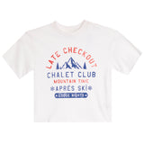 A white short-sleeve crewneck t-shirt featuring a red and blue graphic print on the front that reads 'LATE CHECKOUT CHALET CLUB MOUNTAIN TIME APRÈS SKI LODGE NIGHTS' with a mountain illustration.