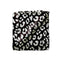 A folded blanket featuring a black and white leopard print pattern, shown against a plain white background.