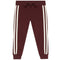 A pair of dark burgundy jogger pants featuring two vertical cream-colored stripes down the sides of each leg, a matching dark burgundy drawstring waist, and ribbed cuffs at the ankles.