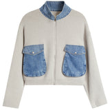 A light beige knit sweater with a contrasting blue denim mock neck collar and a matching frayed hem, shown a white background.