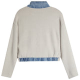 A light beige knit sweater with a contrasting blue denim mock neck collar and a matching frayed hem, shown from the back on a white background.