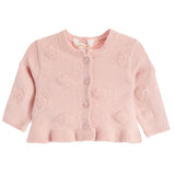 A light pink baby cardigan sweater with textured pom-pom details, buttoned front, and ribbed trim, shown against a plain white background.