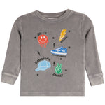 A toddler's long-sleeve waffle-knit shirt in heather gray, featuring a colorful graphic print with a red smiley face, blue sneaker, green peace sign, and other cartoon-style icons with text.