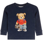 A navy blue long-sleeve waffle-knit shirt for a toddler, featuring a graphic of a teddy bear wearing a red t-shirt, blue jeans, headphones, and holding a boombox.