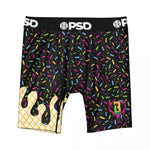 Black boxer briefs with a colorful sprinkle pattern, featuring a gold waffle texture on the left leg and a pink and yellow graphic on the right leg. The waistband is black with white 'PSD' branding.