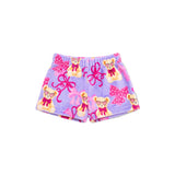 A pair of children's shorts in lavender purple fleece, featuring a playful print of teddy bears wearing sunglasses and pink bows.