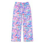 A pair of wide-leg lounge pants featuring a colorful, playful all-over print with cosmetics, makeup tools, and the word 'FABULOUS' in various shades of pink, purple, blue, and yellow on a white background.
