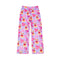 A pair of children's pajama pants in light purple with an all-over print of pink bows, yellow teddy bears wearing glasses, and small pink flowers, shown on a plain white background.
