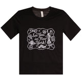 A black short-sleeve crewneck t-shirt with a white graphic print on the front that reads 'See You in New York!' surrounded by travel-themed doodles, shown against a plain white background.