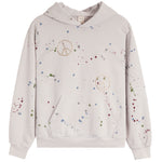 A light beige pullover hoodie with a multicolor paint splatter pattern and two peace sign motifs on the front, displayed against a solid white background.