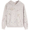 A light beige pullover hoodie with a multicolor paint splatter pattern and two peace sign motifs on the front, displayed against a solid white background.