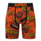 A pair of men's boxer briefs featuring an all-over Reese's Peanut Butter Cups print on a bright orange background, with a black waistband and drawstring.