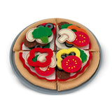 Toy pizza with felt toppings on a white background
