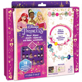 Disney Princess bracelet-making kit in retail packaging, showing a pink and white box with illustrations of princess characters, a bracelet sample, and text indicating 26 pieces and 18 gem charms.