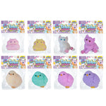 Eight Taba Jucious Squishy Pets in their original packaging, featuring pastel-colored plush animals including a pink pig, yellow cat, white cat, purple cat, beige chick, teal chick, pink chick, and purple chick.